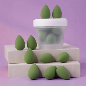 Mini drop-shaped makeup sponge set in a storage jar for wet and dry blending application