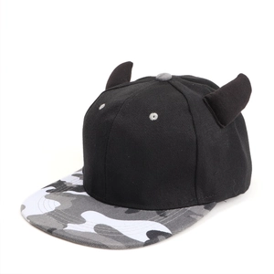 Detail of creative flat brim cap featuring devil horns and camouflage pattern