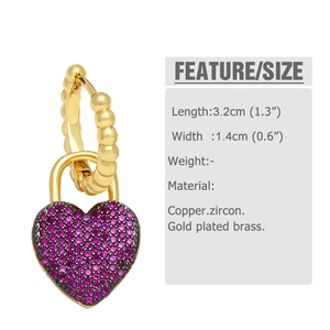 Macro shot of gold heart-shaped padlock earrings with dimensions 3.2cm by 1.4cm