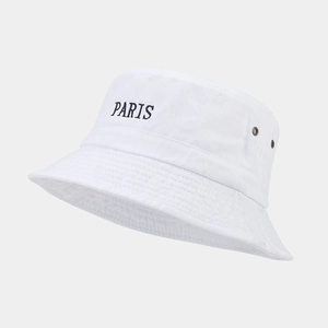 Detail shot of black PARIS embroidery on white washed cotton bucket hat with eyelets