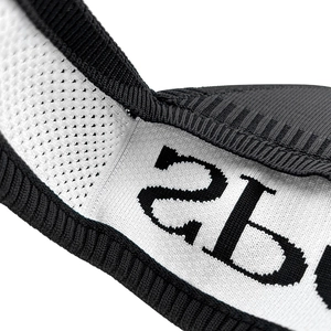 Macro detail of breathable honeycomb mesh fabric with black 2B character for sport visor