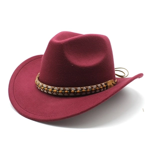 Classic burgundy wool felt western cowboy hat with ethnic beaded band on white background