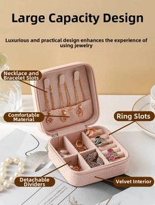 Pink travel jewelry box detail with necklace hooks and ring slots in soft velvet lining