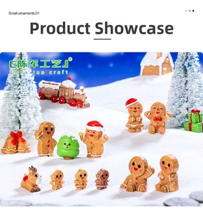 Miniature Christmas resin figurines including gingerbread man and reindeer in snow scene