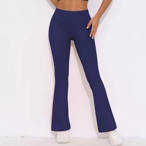 Detail of high-waist flared yoga pants in dark blue featuring a tummy control waistband