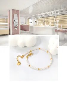 Detail of freshwater pearl bracelet with gold beads and adjustable lobster clasp