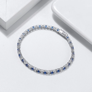 Silver tennis bracelet with alternating blue and white cubic zirconia stones