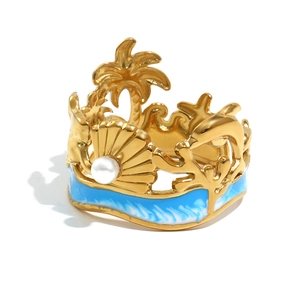 Gold-plated stainless steel starfish ring with blue enamel waves and white pearl
