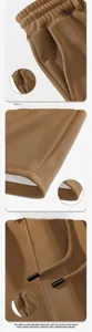 Detail of waffle texture brown shorts with drawstring, side pockets and cuffed hemline