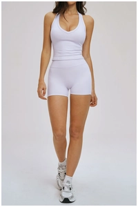 Detail view of light purple yoga set featuring a V-neck halter top and high waist shorts