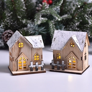 LED wooden Christmas village houses with snowy roofs and warm glowing windows