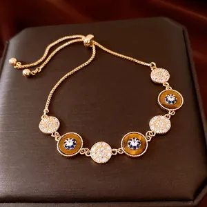Bracelet ajustable plaqué or 18 carats avec œil de tigre et détails étoilés brillants
