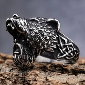 Macro detail of Viking berserker ring in vintage steel with Celtic knot engravings