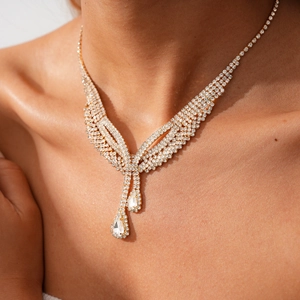 Detailed view of luxury gold double layer necklace with water drop diamond fringe pendants