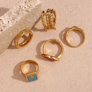 Set of five 18K gold plated vintage rings featuring enamel heart and gemstone details