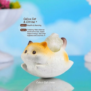 Detailed view of Calico cat resin figurine with natural yellow citrine crystal stone