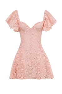 Detail of pink lace dress featuring ruffled cap sleeves and delicate heart neckline texture