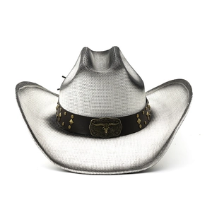 Detail of silver western straw hat with black leather band and metal bull skull ornament