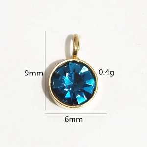 Pendentif pierre de naissance en acier doré 6mm avec cristal bleu facetté