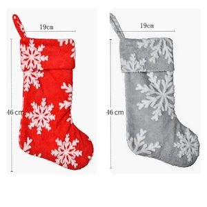 Red and grey plush Christmas stockings with 3D snowflake appliques and size markings