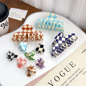 Checkerboard pattern claw clips in various colors and sizes for versatile hair styling