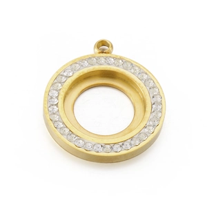 Macro view of a gold circular locket pendant featuring sparkling cubic zirconia borders