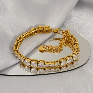 Golden cubic zirconia tennis bracelet with adjustable chain and lobster clasp