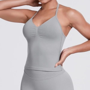 Macro detail of grey sports bra with V-neck and ribbed fabric texture for fitness yoga