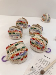 Multi-colored hand-woven mini earphone case with durable zipper and purple carabiner hook