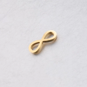 Close-up of a polished gold infinity symbol connector for DIY jewelry making