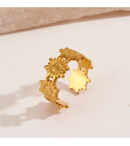 Macro shot of gold daisy flower open ring showing intricate floral petals and texture