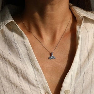 Elegant S925 silver mermaid tail necklace with blue gradient pavé crystals on a model