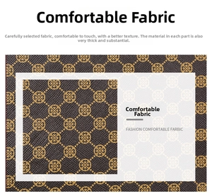 Close-up of vintage brown faux leather fabric with golden floral pattern and grain texture