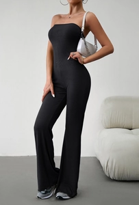 Close-up of elegant black strapless ribbed knit jumpsuit with flared leg design