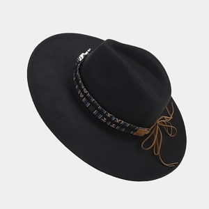 Detail of British style felt fedora featuring ethnic woven band and silver metal accents
