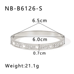 Silver stainless steel bangle with heart design and crystals showing dimension details