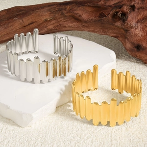 Irregular 18k gold and silver stainless steel open bangles with wavy cylindrical design