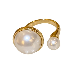French style gold plated irregular ring with double pearls on white background
