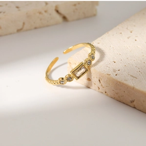 Detailed view of 18K gold plated stainless steel ring with rectangular zircon stone