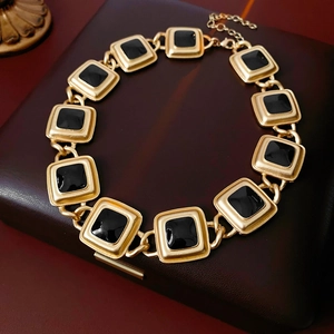 Vintage gold square link necklace with black enamel inlay on dark textured box