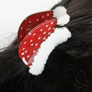 Christmas Santa hat hair claw clip with red glitter and white snowflake patterns