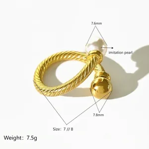 Titanium steel ring with twisted design featuring imitation pearl and gold metal ball