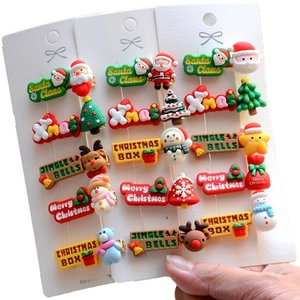 Christmas hair clip set featuring Santa, reindeer, and tree icons on display cards