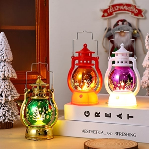 Three LED Christmas lanterns in red, gold, and white with Santa and deer festive patterns