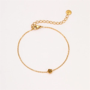 Detail of adjustable gold stainless steel bracelet with a delicate 3D rose flower pendant