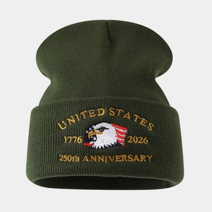 Close-up of US Marine Corps eagle embroidery on green 250th anniversary knit beanie