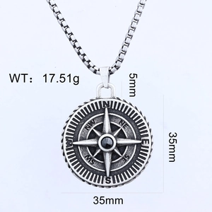 Detail view of vintage silver compass pendant with black gemstone and size dimensions