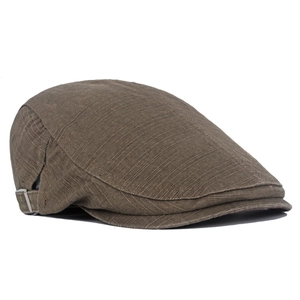 Side view of washed cotton flat cap in dark brown with metal adjustable buckle