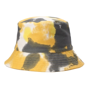 Detailed close-up of the yellow and grey tie-dye cotton fabric on this reversible bucket hat