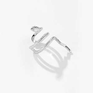 Macro detail of the silver snake cuff earring showing intricate scale textures and metallic shine